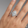 Marquise cut diamond engagement ring in 14k white gold with a diamond channel band and split setting on a hand