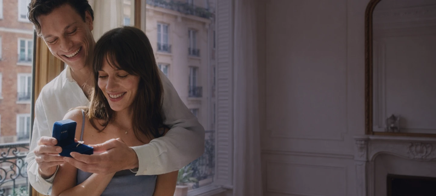 Couple sharing a proposal moment in Paris