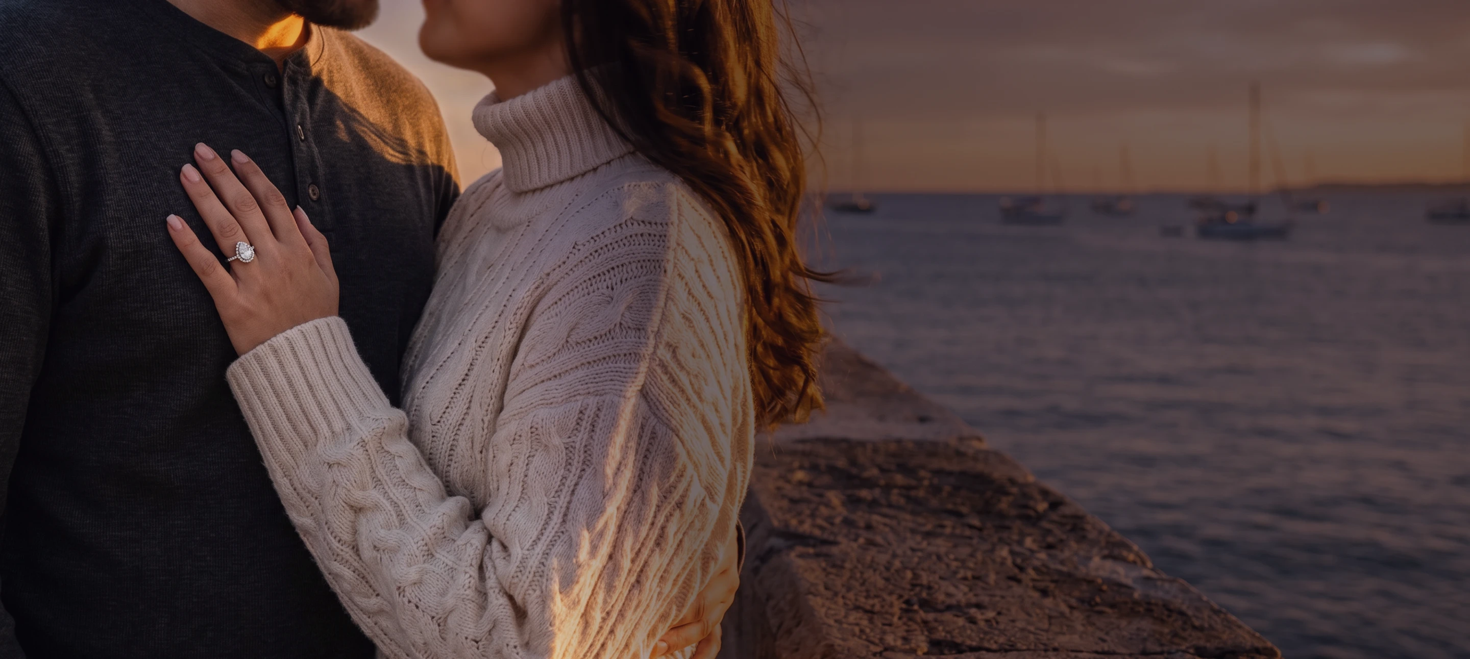 Couple at sunset, woman wearing a lab-grown diamond engagement ring by Amorati