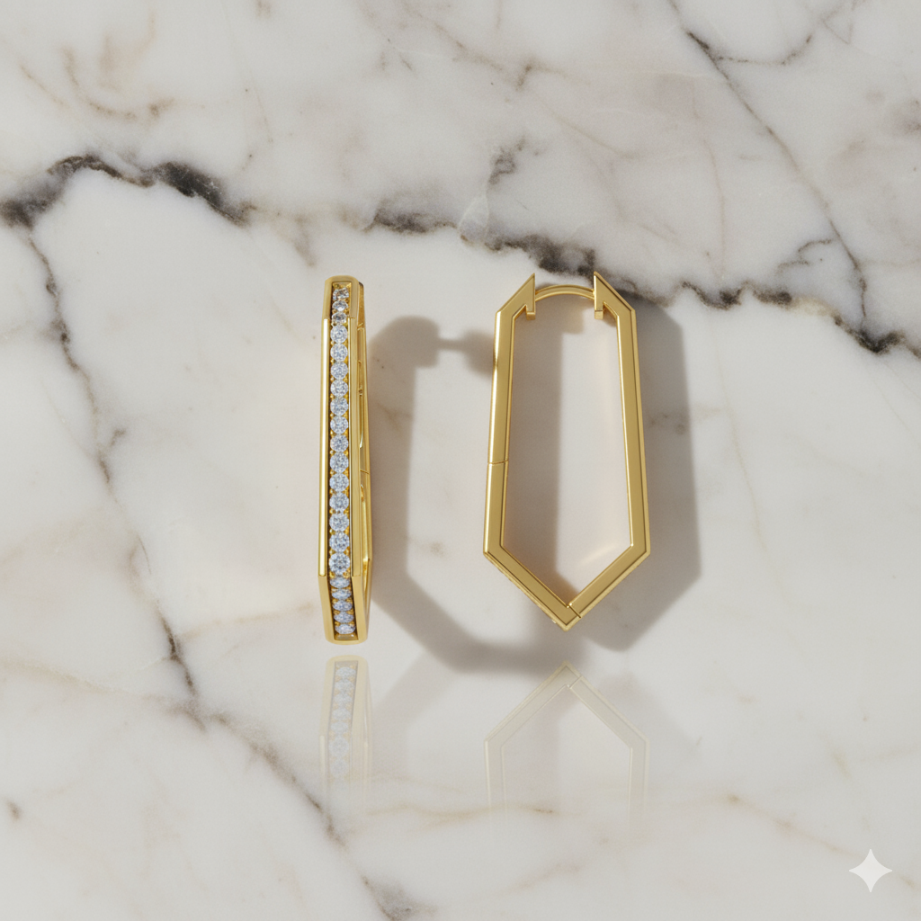 A profile view of a 14K yellow gold oval huggie hoop, showcasing the thin band and the all-around sparkle on a marble background.