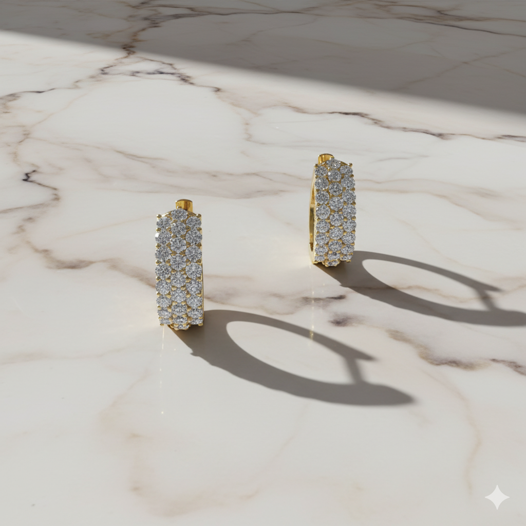 A pair of 14K white gold huggie hoops with three parallel rows of pavé diamonds, shown from the front