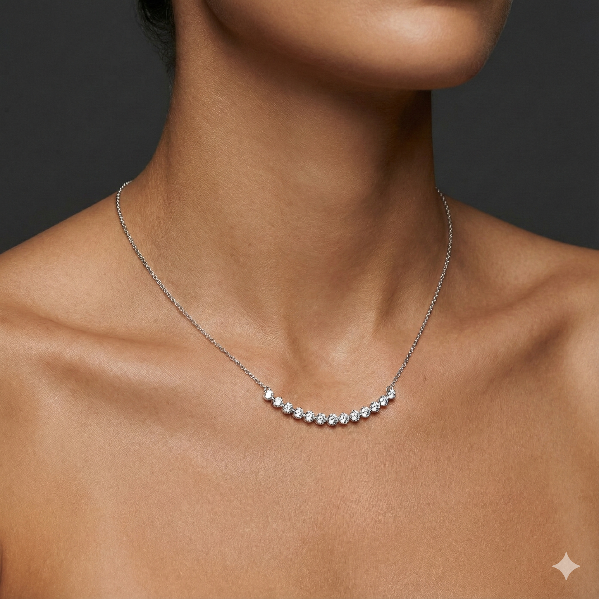 Lifestyle view of a white gold necklace worn on the neck, showcasing round white diamonds along a curved design.