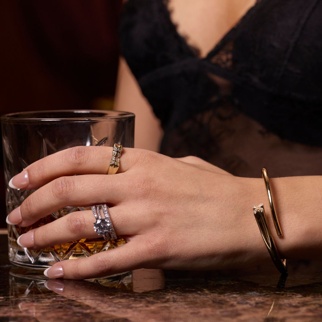 A bold, high-polish 14k yellow gold statement cuff designed exclusively by Amorati, featuring a diamond flowers made up of shimmering round lab-grown diamonds.