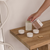 Hutwoods Tonka Bean & Coconut Maxi Tea Lights Pack of 3 lifestyle image 2