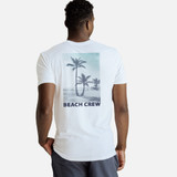 back view of model wearing a white crew tee with our beach crew design