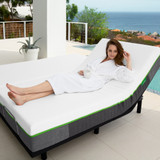 A woman lying on a mattress on top of a classic comfort base