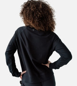 back view of model wearing black pullover sweatshirt