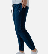 side close-up of models legs wearing navy joggers