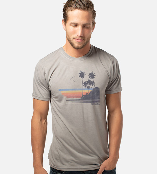 front view of model wearing gray comfort crew with rainbow island design