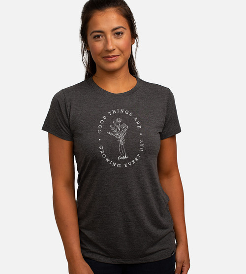 front view of model wearing crew tee with good things growing graphic