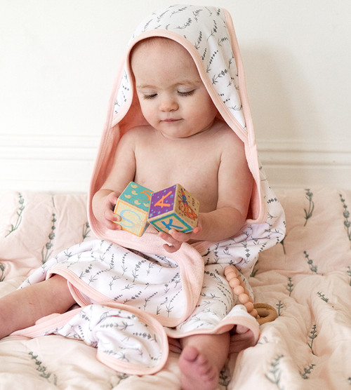 baby wrapped in wildflowers towel