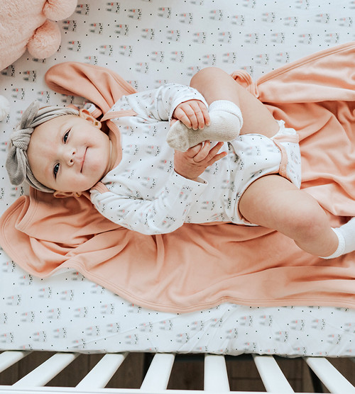 baby wearing bunny bodysuit