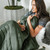 model wrapped in oasis green quilt