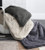 all 3 plush blankets falling out of a basket