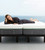 model laying on a mattress that is on our foundation base