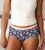 front view close-up of model wearing navy floral boyshorts