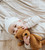 baby laying on stripes receiving blanket