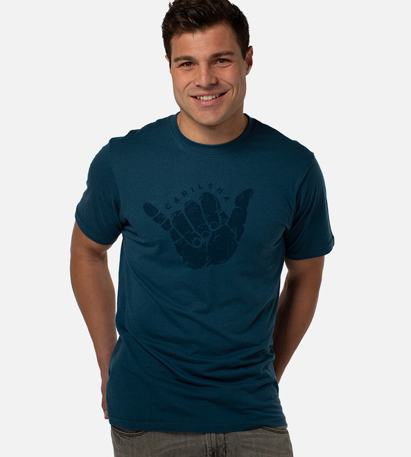 front view of model bermuda blue tee with shaka design