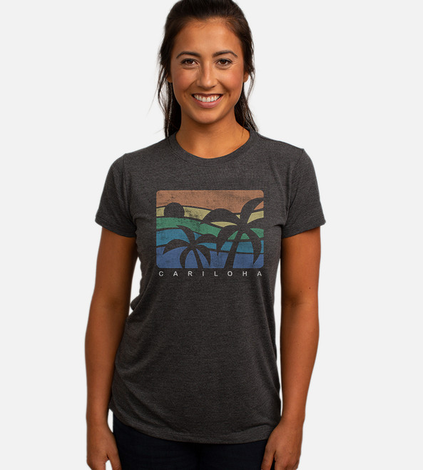 front view of model wearing charcoal crew tee with fun palms design