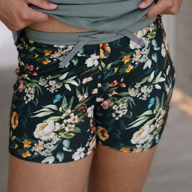 front view of models legs wearing vintage floral print sleep shorts
