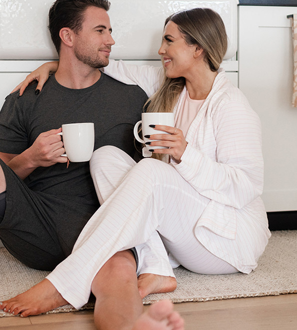 side view of model wearing soft pink stripes robe