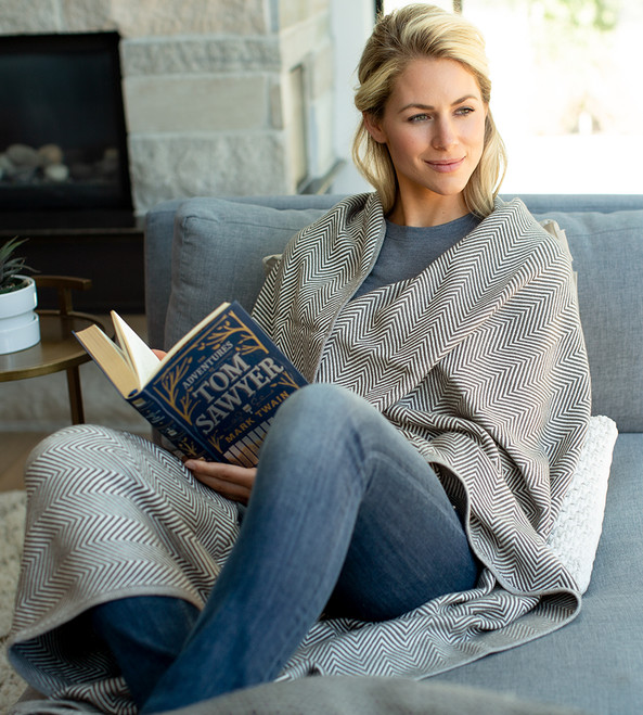 model wrapped in Herringbone White/Onyx knit throw