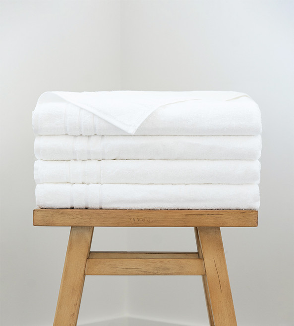 4 bath sheets on a stool