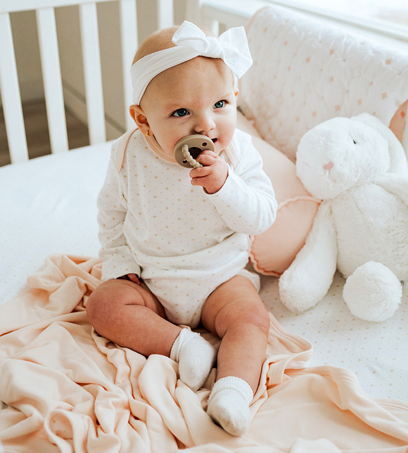 baby wearing diamond bodysuit