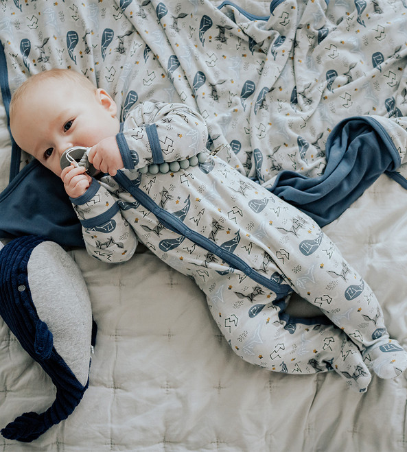 baby wearing whale romper