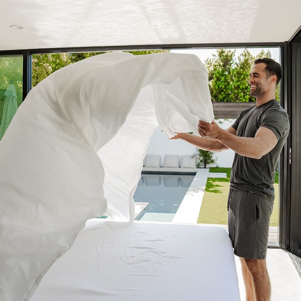 Bright bedroom with crisp white Cariloha bamboo sheets