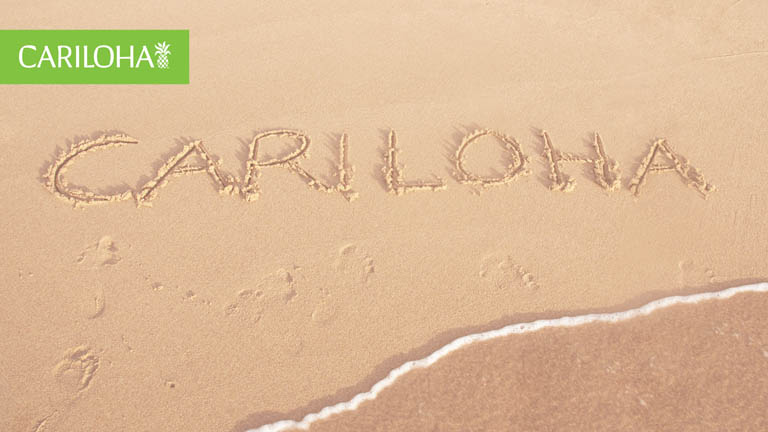 cariloha written in beach sand