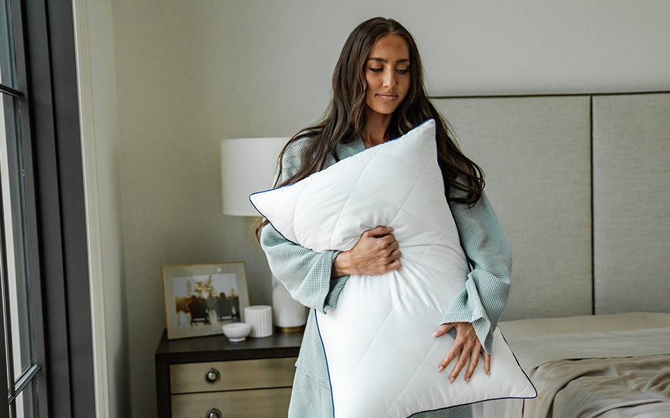 Woman holding a bamboo pillow