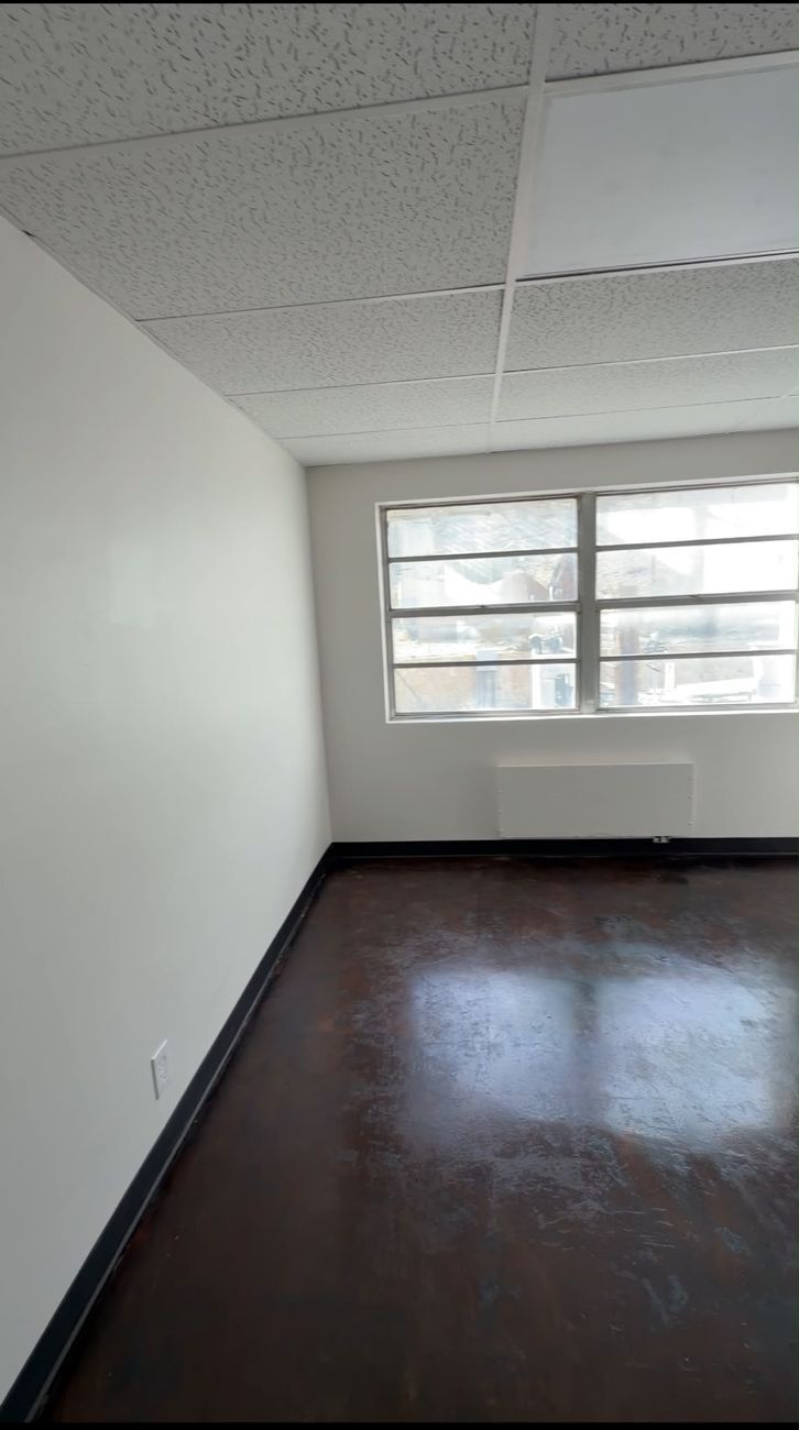 Office with dark wood floors