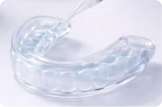 Add gel to each tooth reservoir