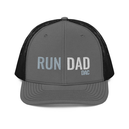 Charcoal/Black six-panel snapback-style trucker cap with embroidered Run DAD logo, front view — DAD all caps