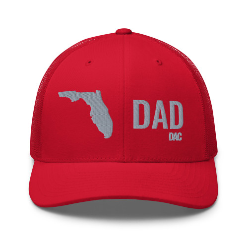 Red six-panel mesh-back trucker cap with embroidered Florida DAD logo, front view — DAD all caps