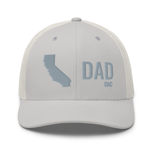 Silver six-panel mesh-back trucker cap with embroidered Cali DAD logo, front view — DAD all caps
