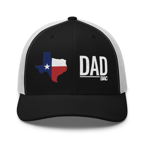 Black/White six-panel mesh-back trucker cap with state flag color embroidered Texas DAD logo, front view — DAD all caps