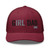 Cranberry six-panel mesh-back trucker cap with embroidered Girl DAD logo, front view — DAD all caps