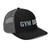 Black/Charcoal six-panel snapback-style trucker cap with embroidered Gym DAD logo, right-front view — DAD all caps