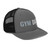 Charcoal/Black six-panel snapback-style trucker cap with embroidered Gym DAD logo, right-front view — DAD all caps