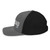 Charcoal/Black six-panel snapback-style trucker cap with embroidered Lift DAD logo, left side view — DAD all caps