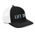 Black/White six-panel snapback-style trucker cap with embroidered Lift DAD logo, right-front view — DAD all caps