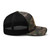 Camo/Black camouflage mesh-back trucker hat with embroidered Fish Hunt Shoot logo, right side view — DAD all caps