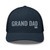 Navy six-panel mesh-back trucker cap with embroidered Grand DAD logo, front view — DAD all caps