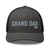 Charcoal/Black six-panel mesh-back trucker cap with embroidered Grand DAD logo, front view — DAD all caps