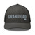 Charcoal six-panel mesh-back trucker cap with embroidered Grand DAD logo, front view — DAD all caps