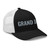Black/White six-panel mesh-back trucker cap with embroidered Grand DAD logo, right-front view — DAD all caps
