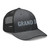Dark Heather Gray six-panel mesh-back trucker cap with embroidered Grand DAD logo, right-front view — DAD all caps