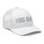 White six-panel mesh-back trucker cap with embroidered OG DAD logo, right-front view — DAD all caps